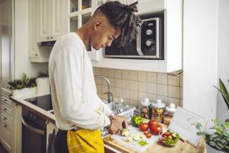 young man cooking